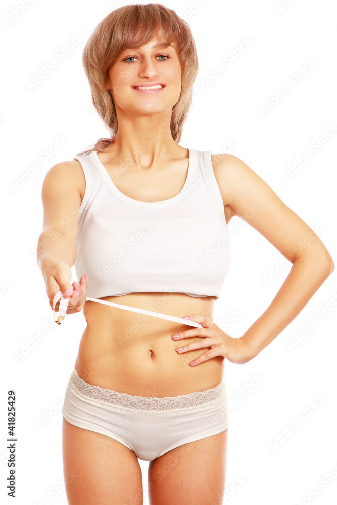 A female is measuring her waist white measure tape A female is measuring her waist white measure tape