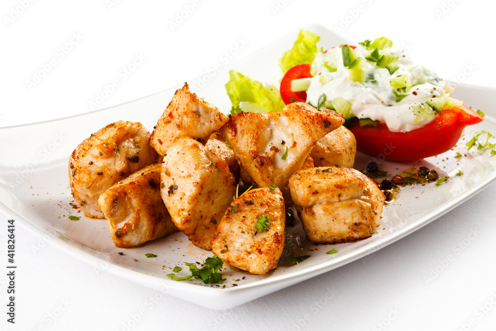 Grilled meat and vegetables on white background Grilled meat and vegetables on white background