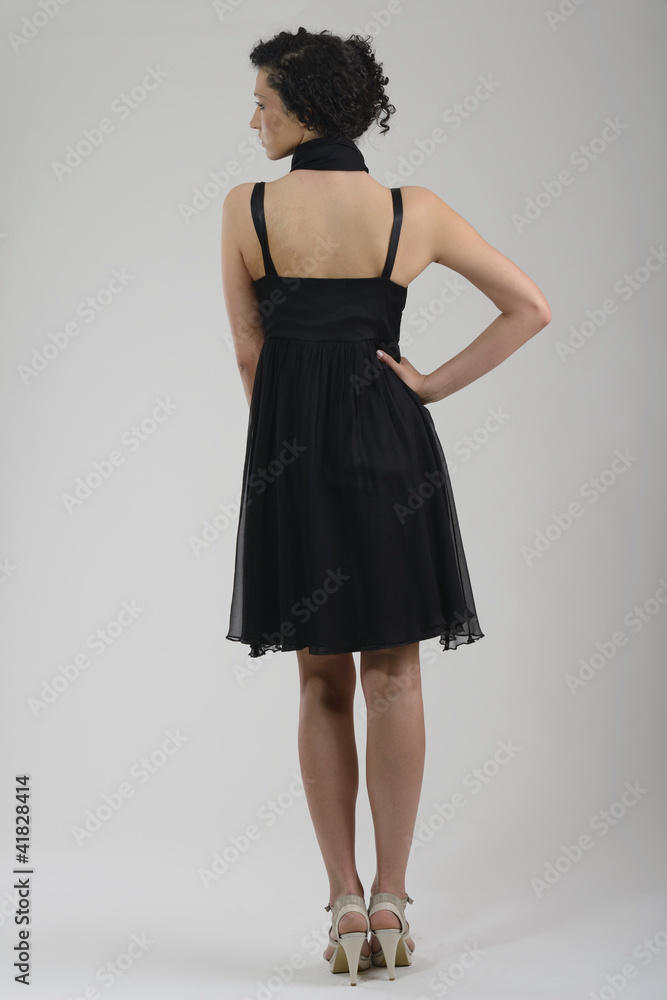 Fototapeta premium elegant woman in fashionable dress posing in the studio