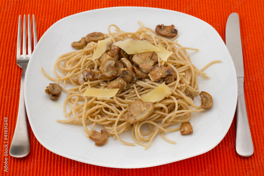 spaghetti with mushrooms and cheese on the plate spaghetti with mushrooms and cheese on the plate