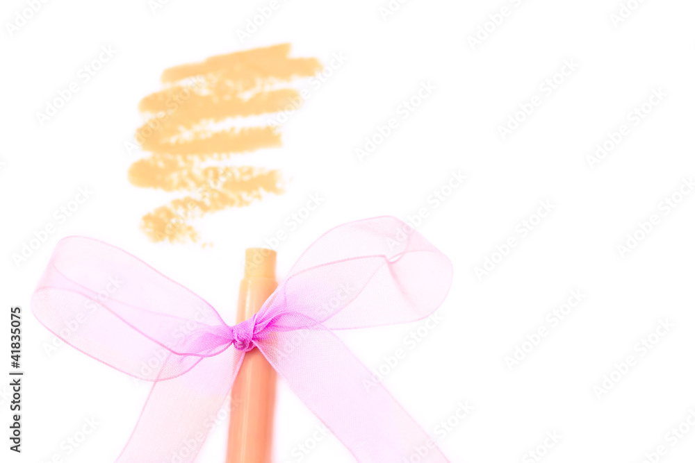 Fototapeta premium foundation/concealer pencil with stroke on white