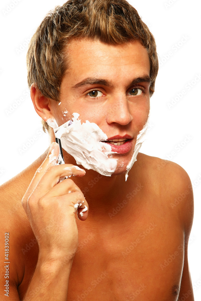Close up portrait of young  man face with perfect skin shaving