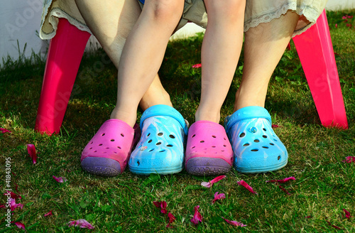 Photos Feet in crocks on grass in colors