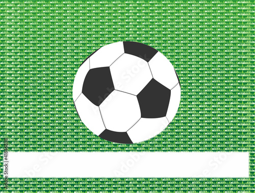 Soccer ball on green grass abstract background