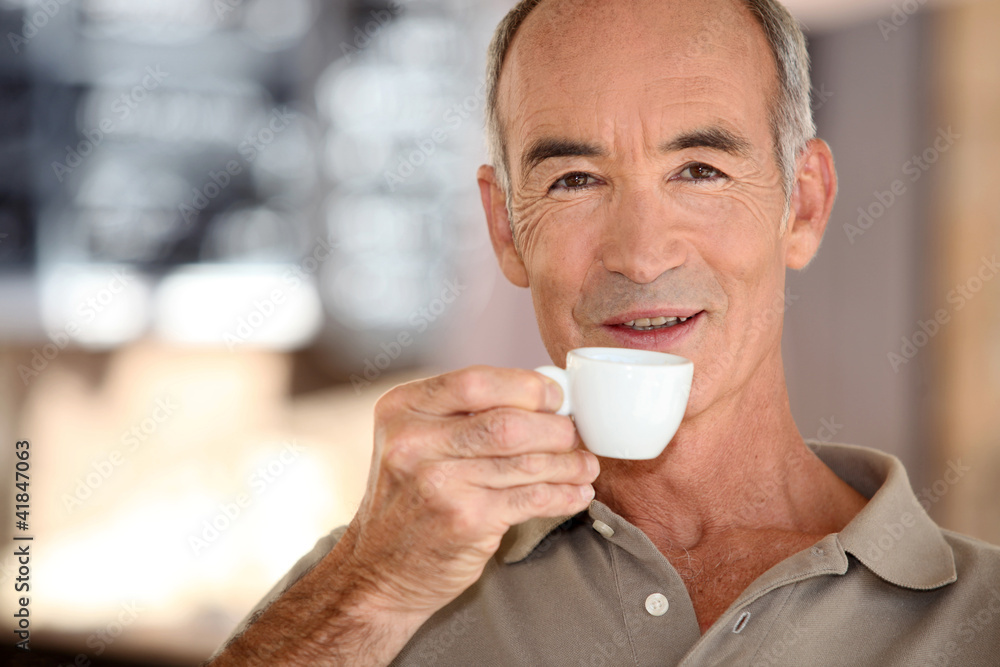 Elderly man drinking coffee