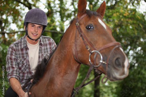 Teen riding a horse