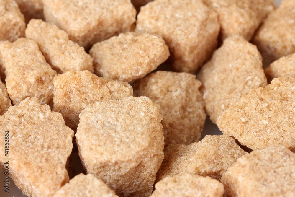 brown cane sugar cubes background close-up brown cane sugar cubes background close-up