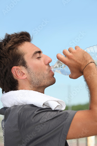 Man drinking bottle of water