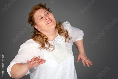 Quadro em tela dancing fat woman on gray background