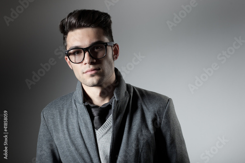 attractive man dressed casual wearing glasses - studio shot © matusciac