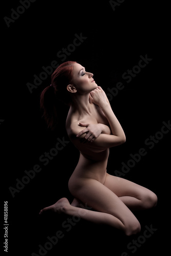 nude sexy woman sit at dark