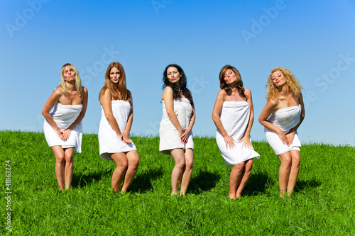 Women with towel on meadow