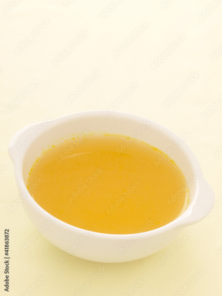 close up of a bowl of chicken broth close up of a bowl of chicken broth