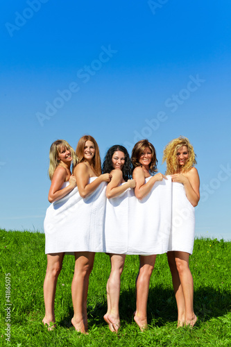 Women with towel on meadow