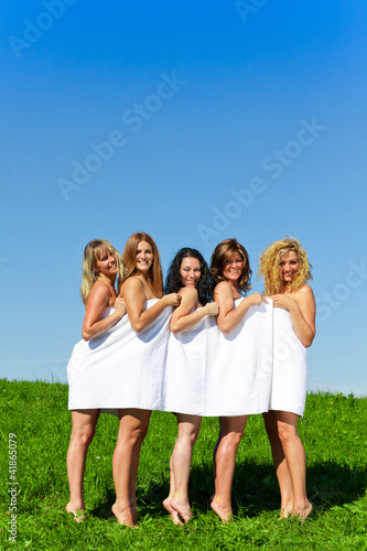 Women with towel on meadow