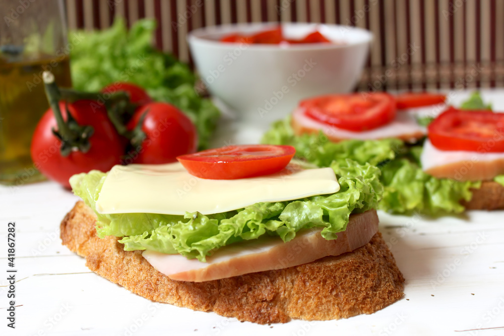 sandwich with tomato, cheese, bacon and salad sandwich with tomato, cheese, bacon and salad