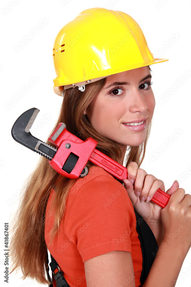 beautiful craftswoman holding a spanner beautiful craftswoman holding a spanner