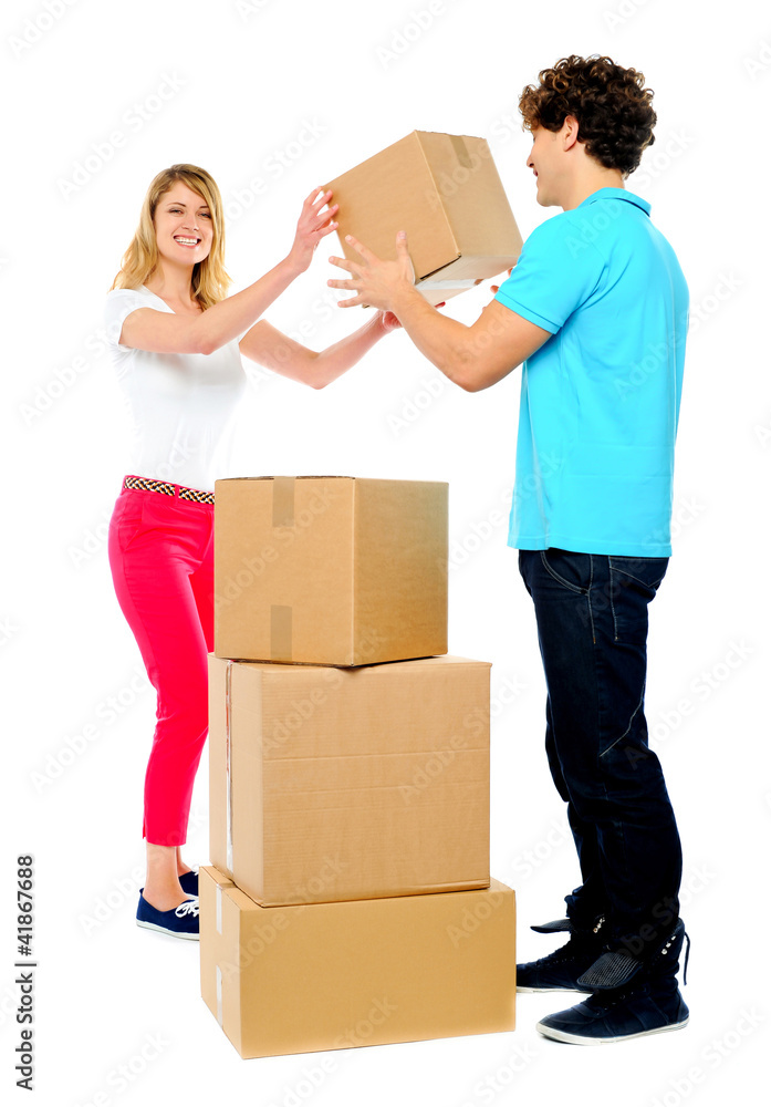 Couple carrying empty cartons Couple carrying empty cartons