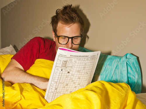 man making crossword puzzle
