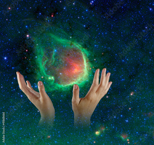 Galaxy in hands.Elements of this image furnished by NASA