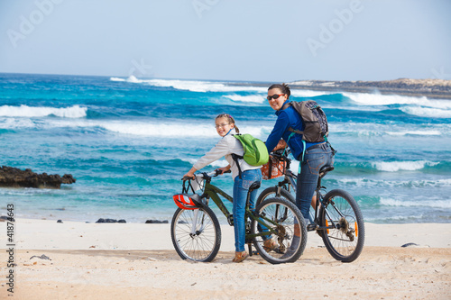 Family having a excursion on their bikes © Max Topchii