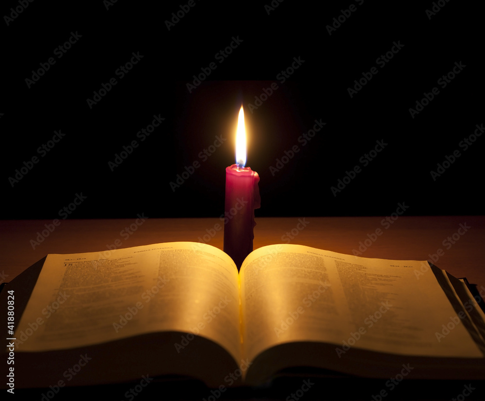 Fototapeta premium bible and candle in night