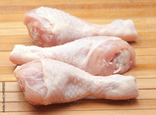 three crude chicken legs