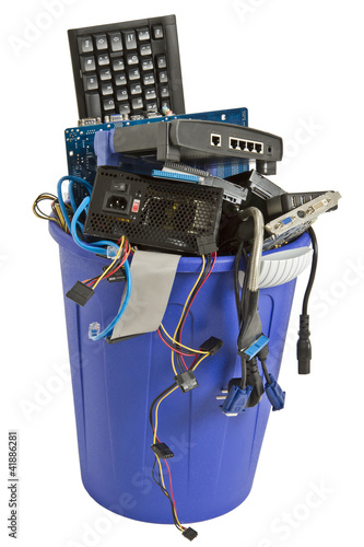 electronic scrap in blue trash can