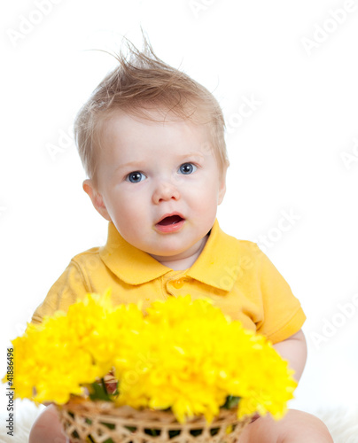 cute baby boy holding baske...