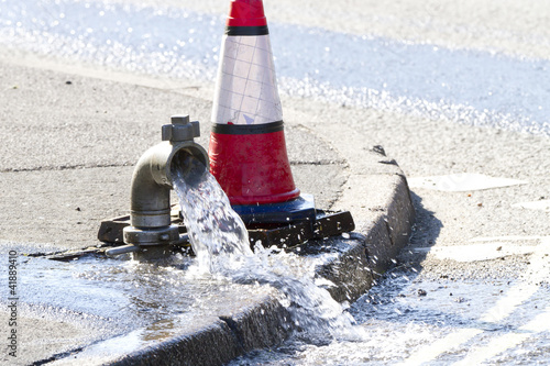 Water being released while a water main is repaired