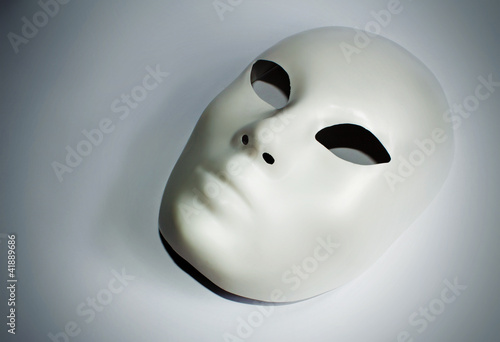 dramatic theatre concept with the white plastic mask