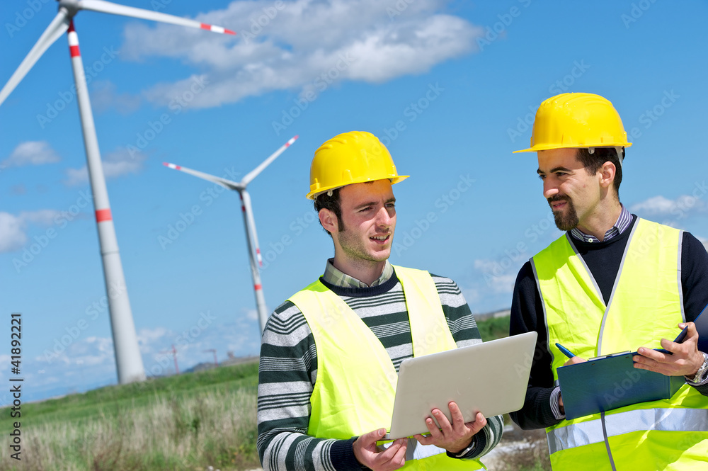 Two Engineers in a Wind Turbine Power Station Two Engineers in a Wind Turbine Power Station
