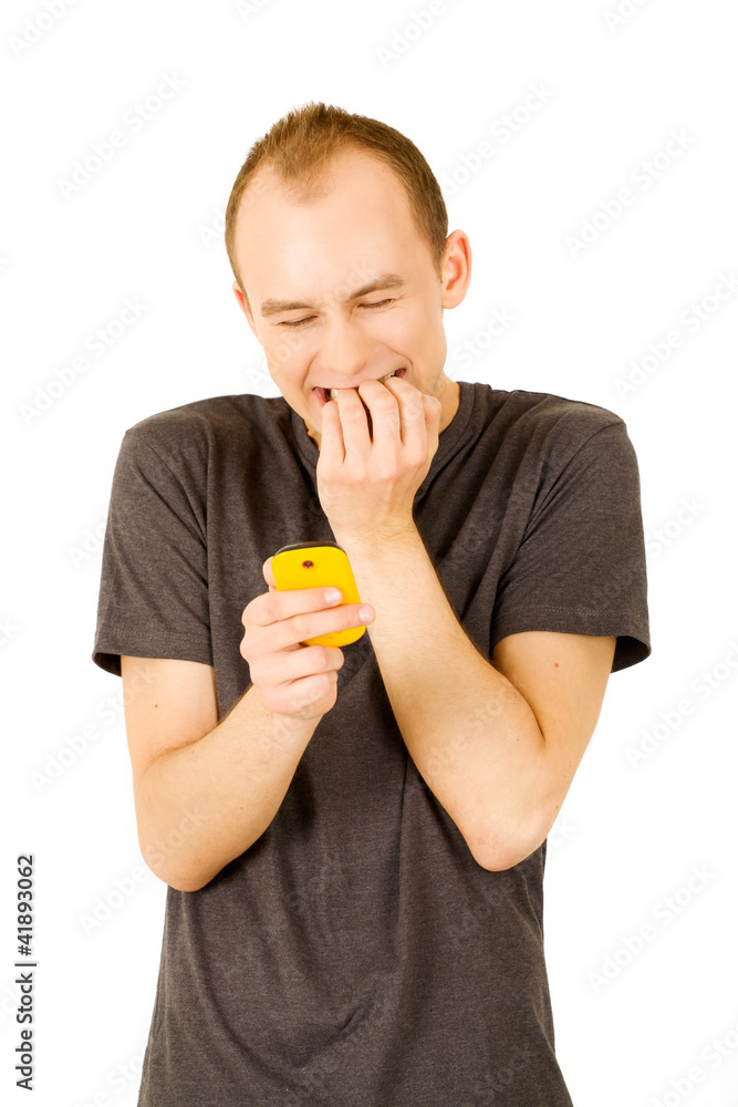 young man holding his phone and texting young man holding his phone and texting