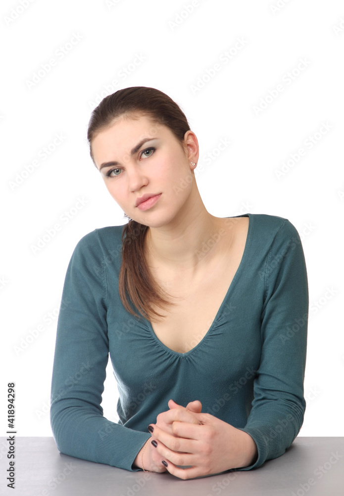 Closeup portrait of young woman sitting at the desk Closeup portrait of young woman sitting at the desk
