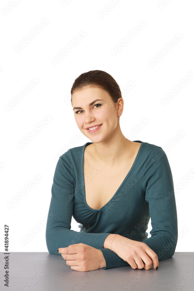Closeup portrait of an attractive young woman sitting at a desk Closeup portrait of an attractive young woman sitting at a desk