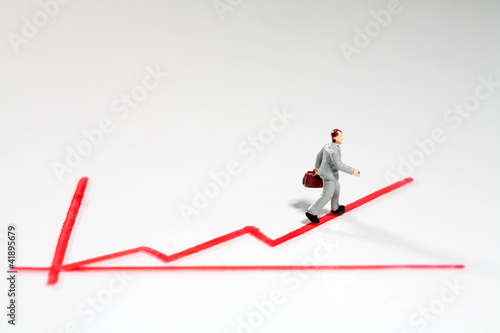 Quadro su tela Mini Figur folgt aufsteigendem Graph.