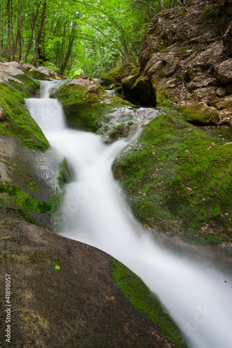 nice small waterfall on mountain stream