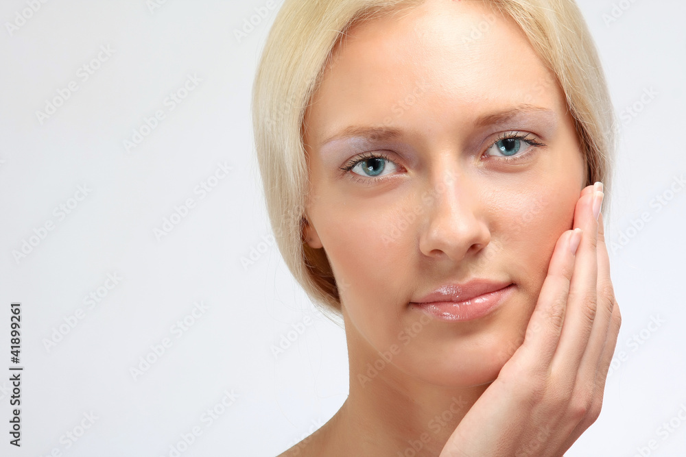 Closeup portrait of a beautiful woman, isolated on white Closeup portrait of a beautiful woman, isolated on white