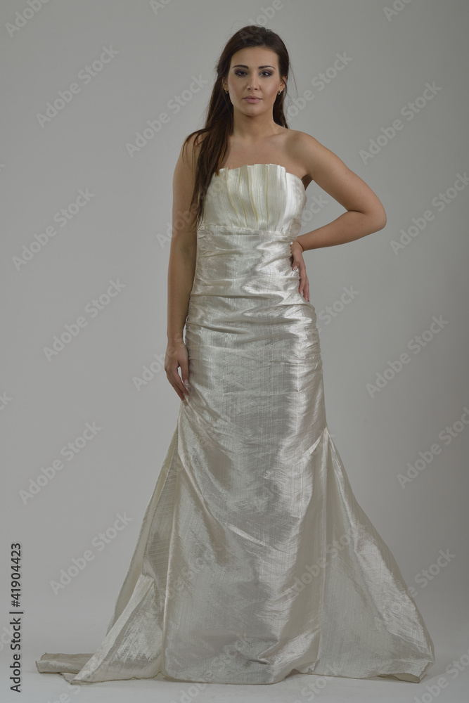 elegant woman in fashionable dress posing in the studio elegant woman in fashionable dress posing in the studio