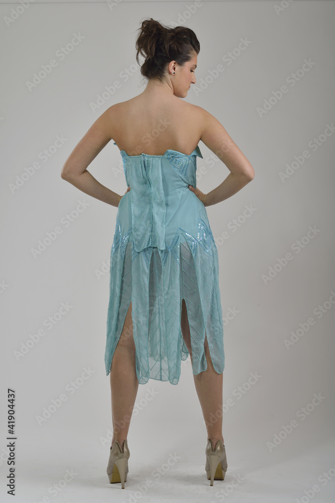 Fototapeta premium elegant woman in fashionable dress posing in the studio