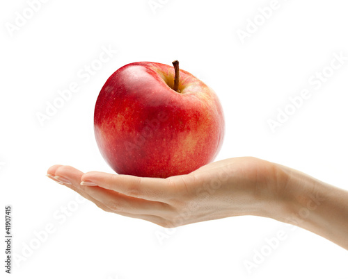 Female hand with an apple