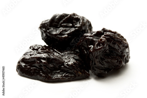 Prunes on the white background
