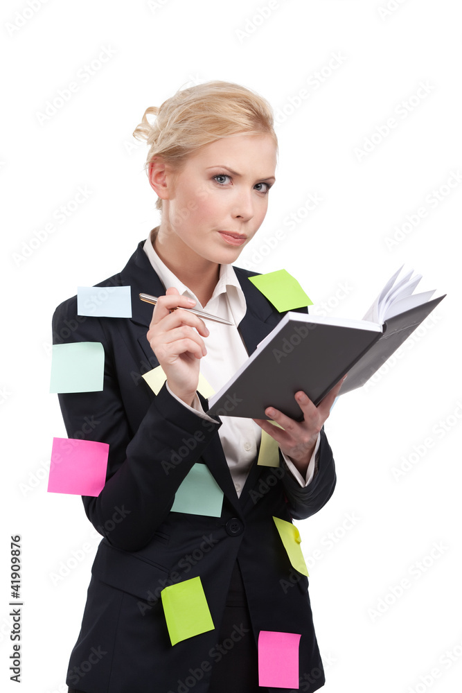 Young business woman in a black suit holding pen Young business woman in a black suit holding pen