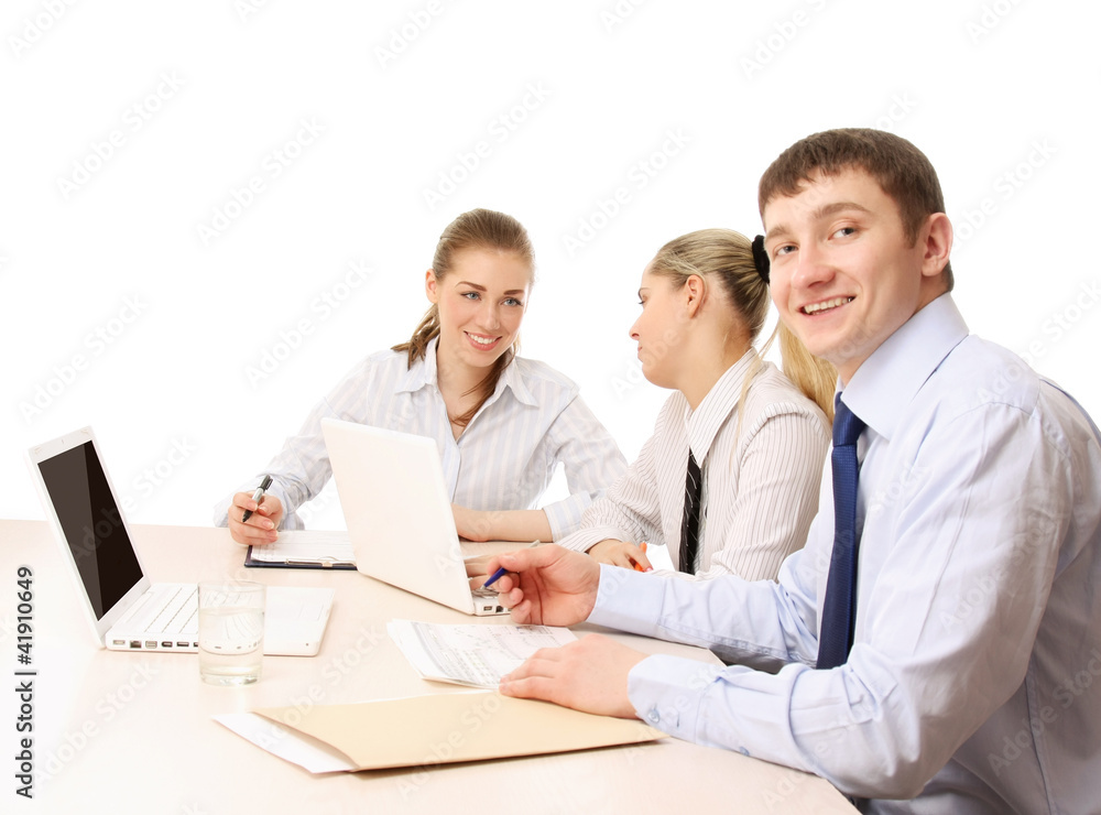 A businessgroup working at the table, isolated on white