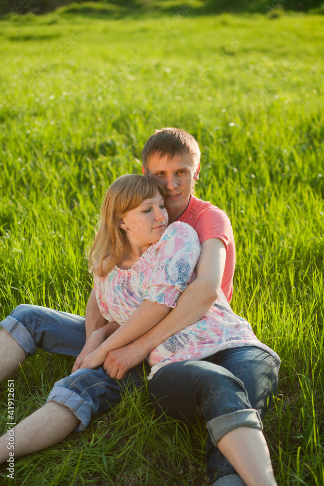 Happy couple lying on grass Happy couple lying on grass