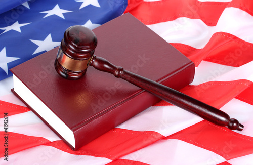 judge gavel and book on american flag background