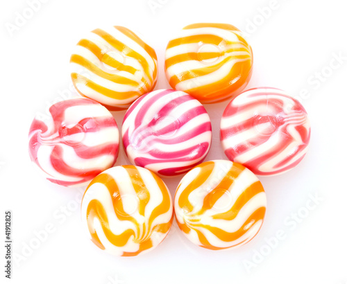 striped fruit candies isolated on white