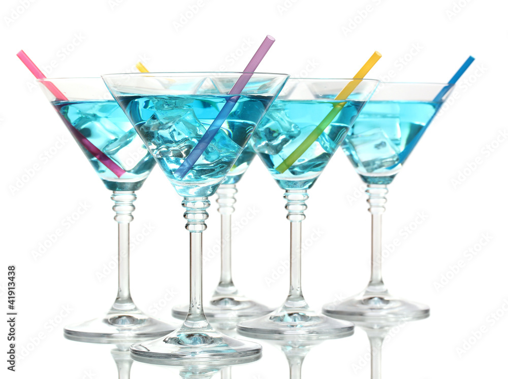 Blue cocktail in martini glasses isolated on white Blue cocktail in martini glasses isolated on white