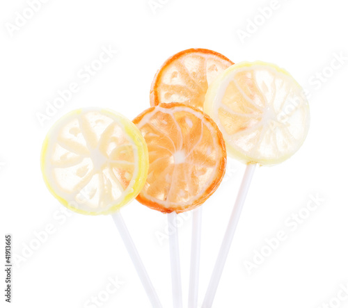 fruit lollipops isolated on white photo