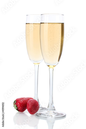 glasses of champagne and strawberries isolated on a white